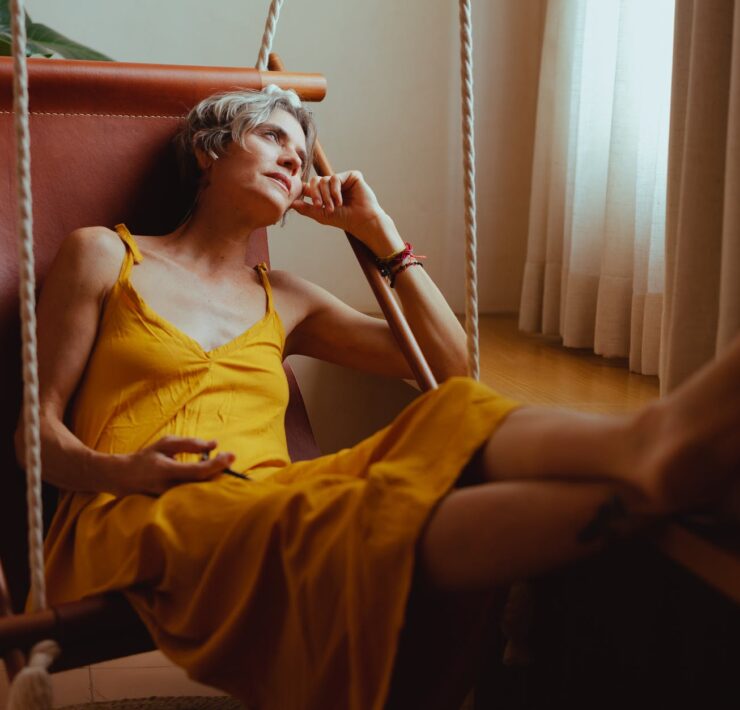 elderly woman relaxing on her hammock