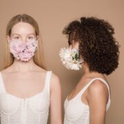 calm diverse women in flower masks