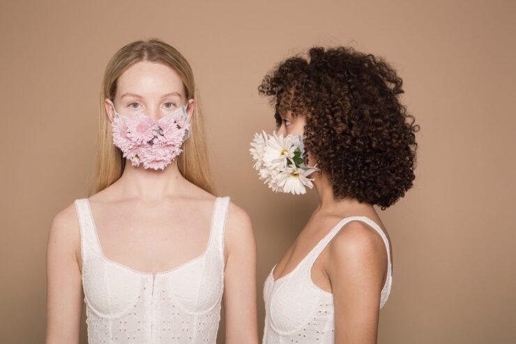 calm diverse women in flower masks