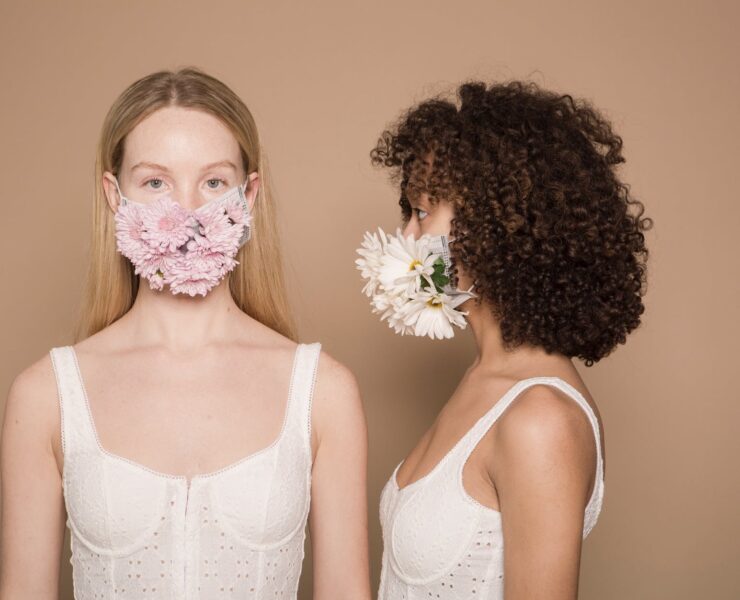 calm diverse women in flower masks