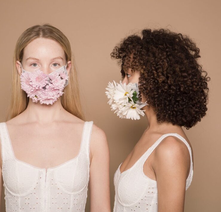 calm diverse women in flower masks
