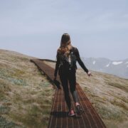 a woman hiking on a mountain