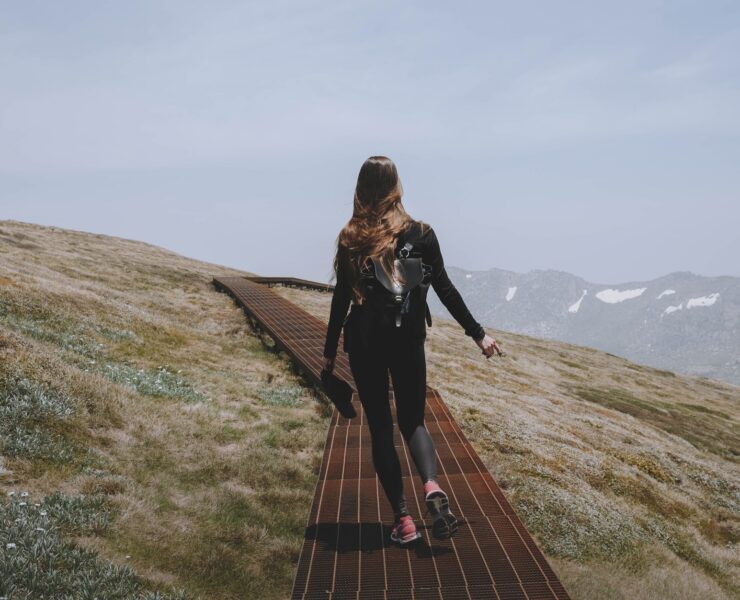 a woman hiking on a mountain