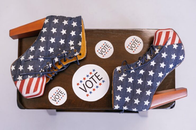 american flag themed high heels on wooden surface