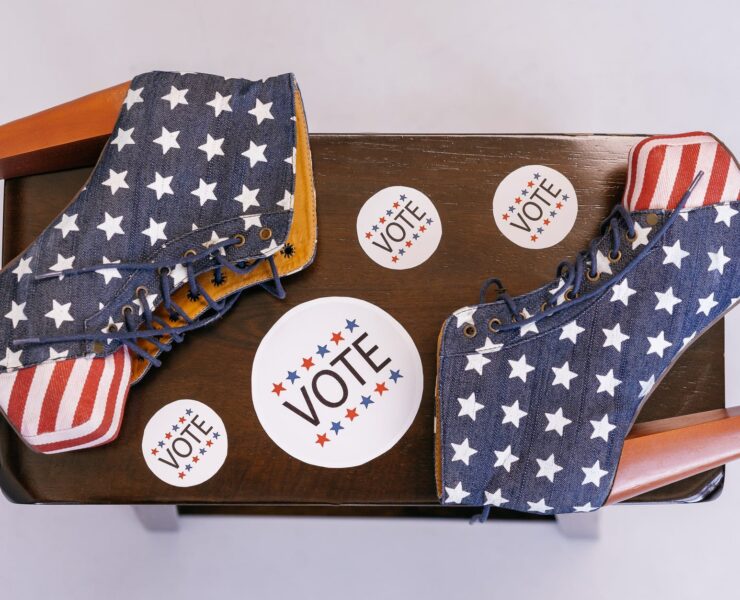 american flag themed high heels on wooden surface