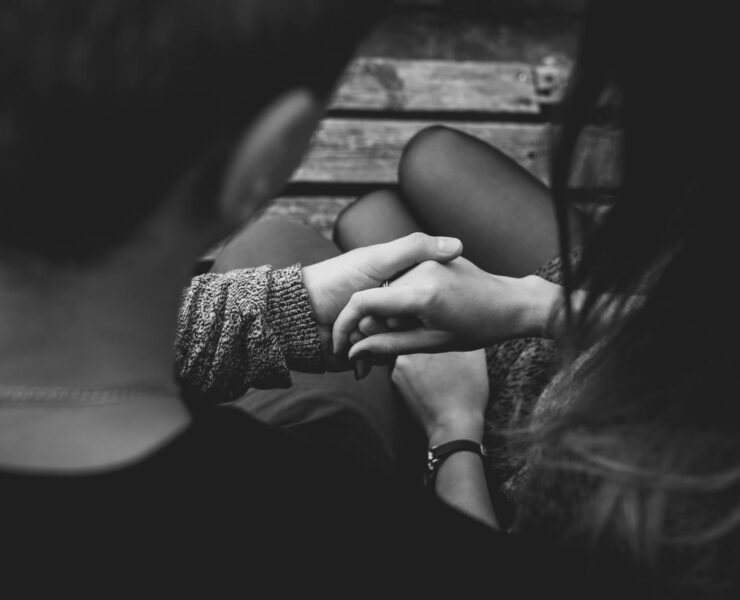 close up of couple holding hands