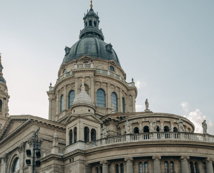 brown concrete building under blue sky