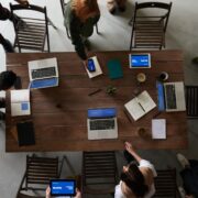 photo of laptops on top of wooden table